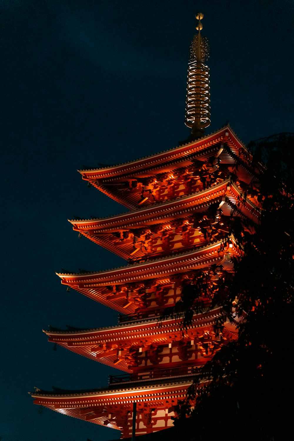 a tall tower with lights at night