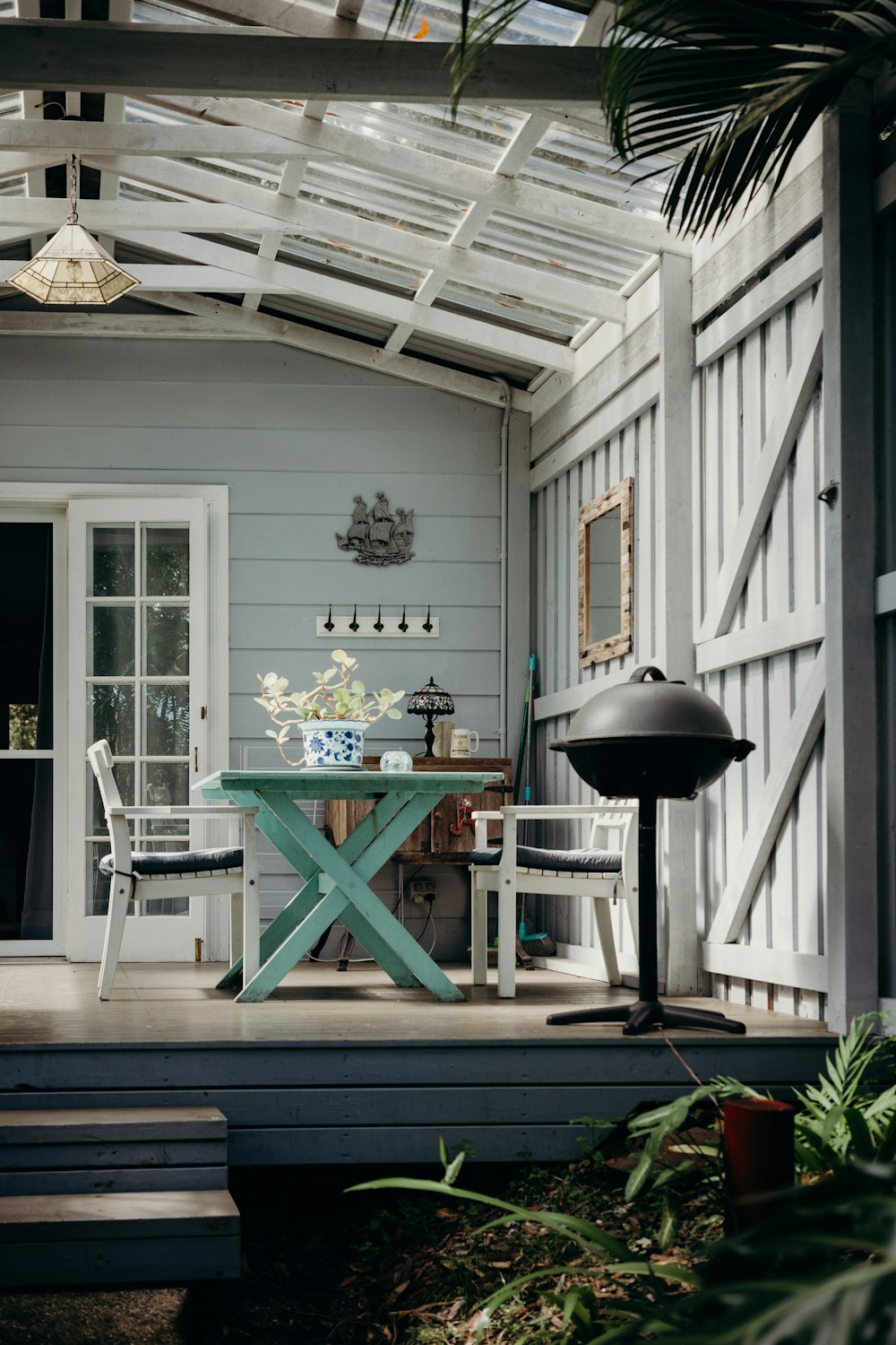 a table and chairs outside a house