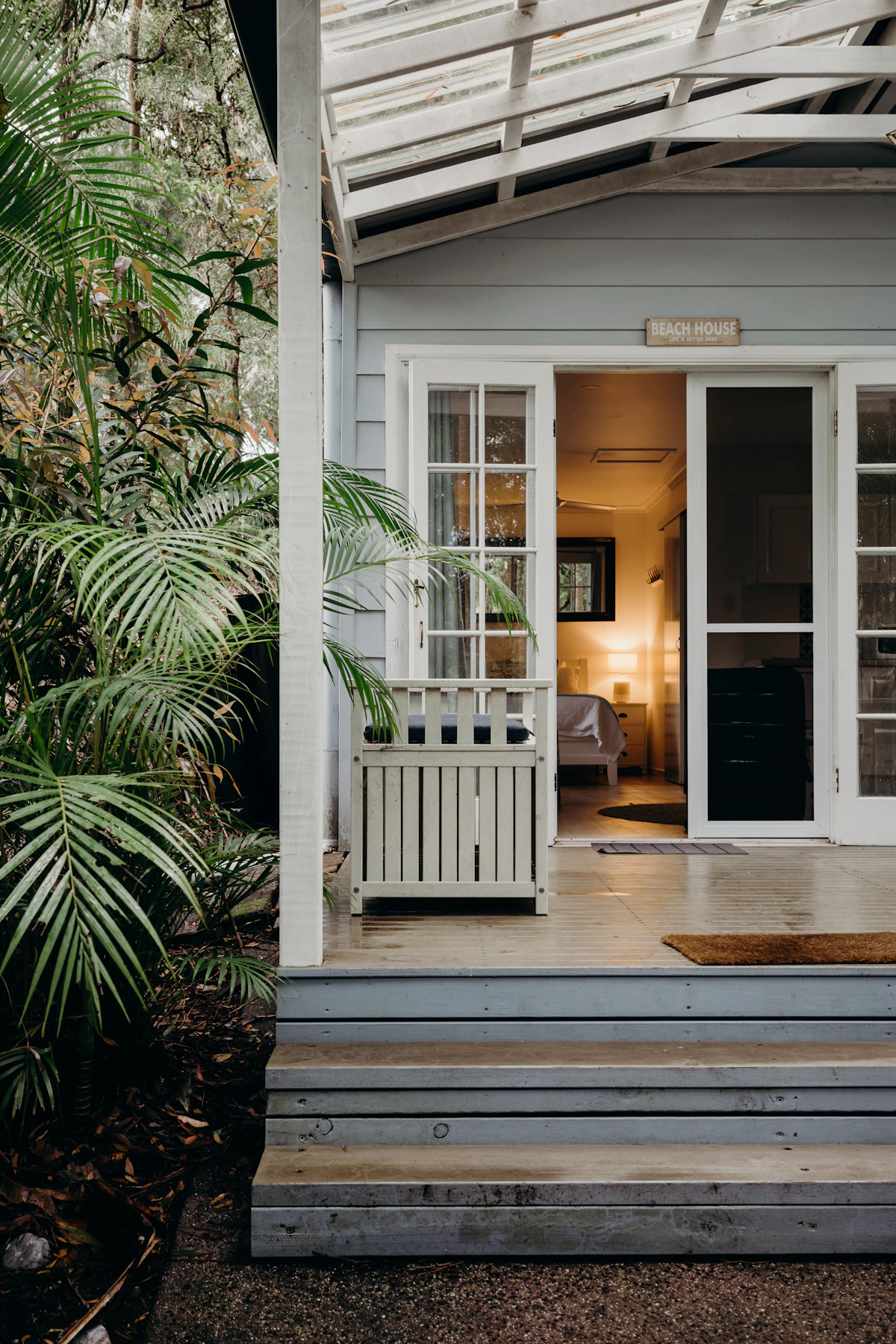 A Byron Bay beach house with a wide timber deck and porch
