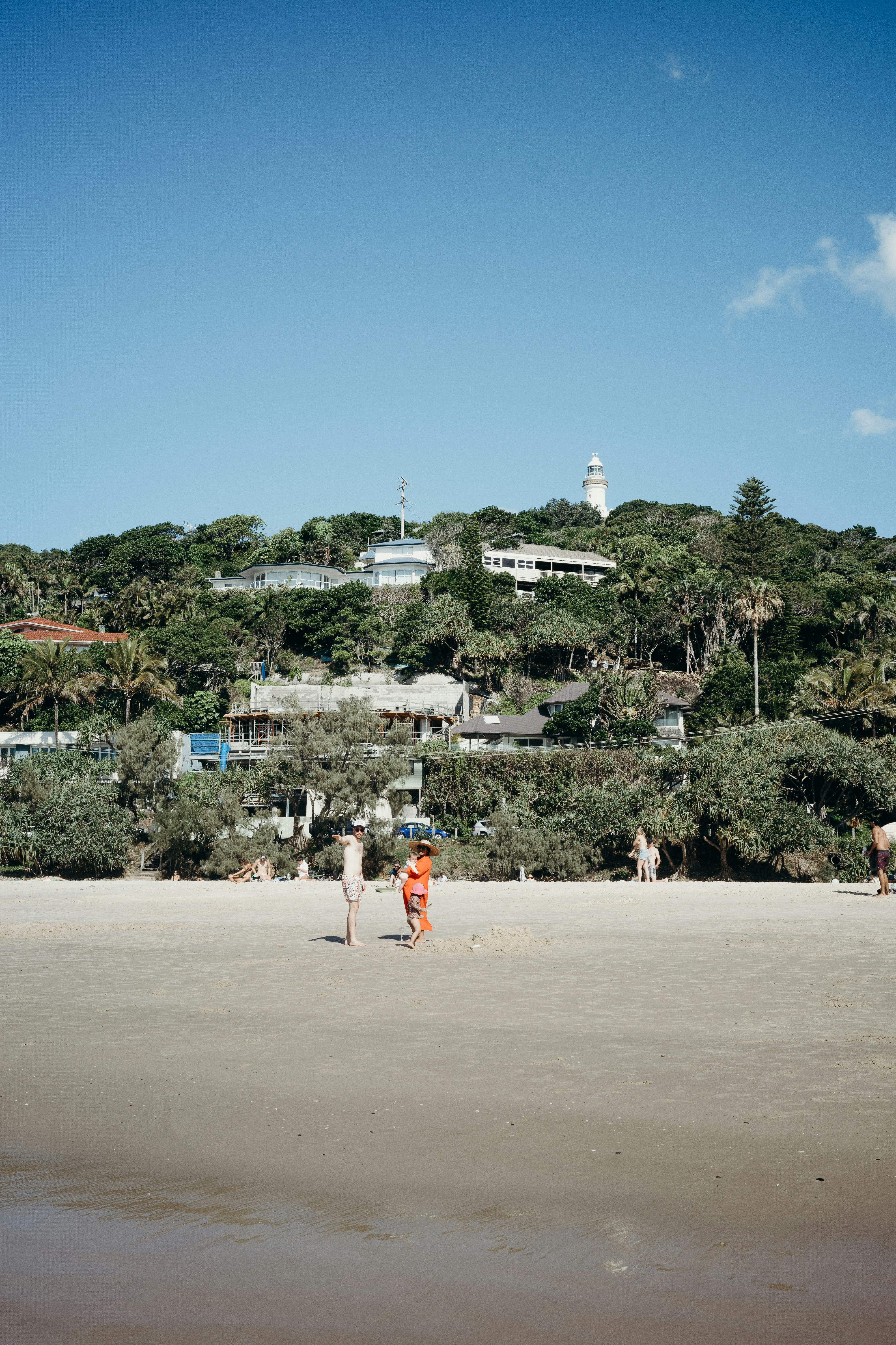 a group of people play on the beach