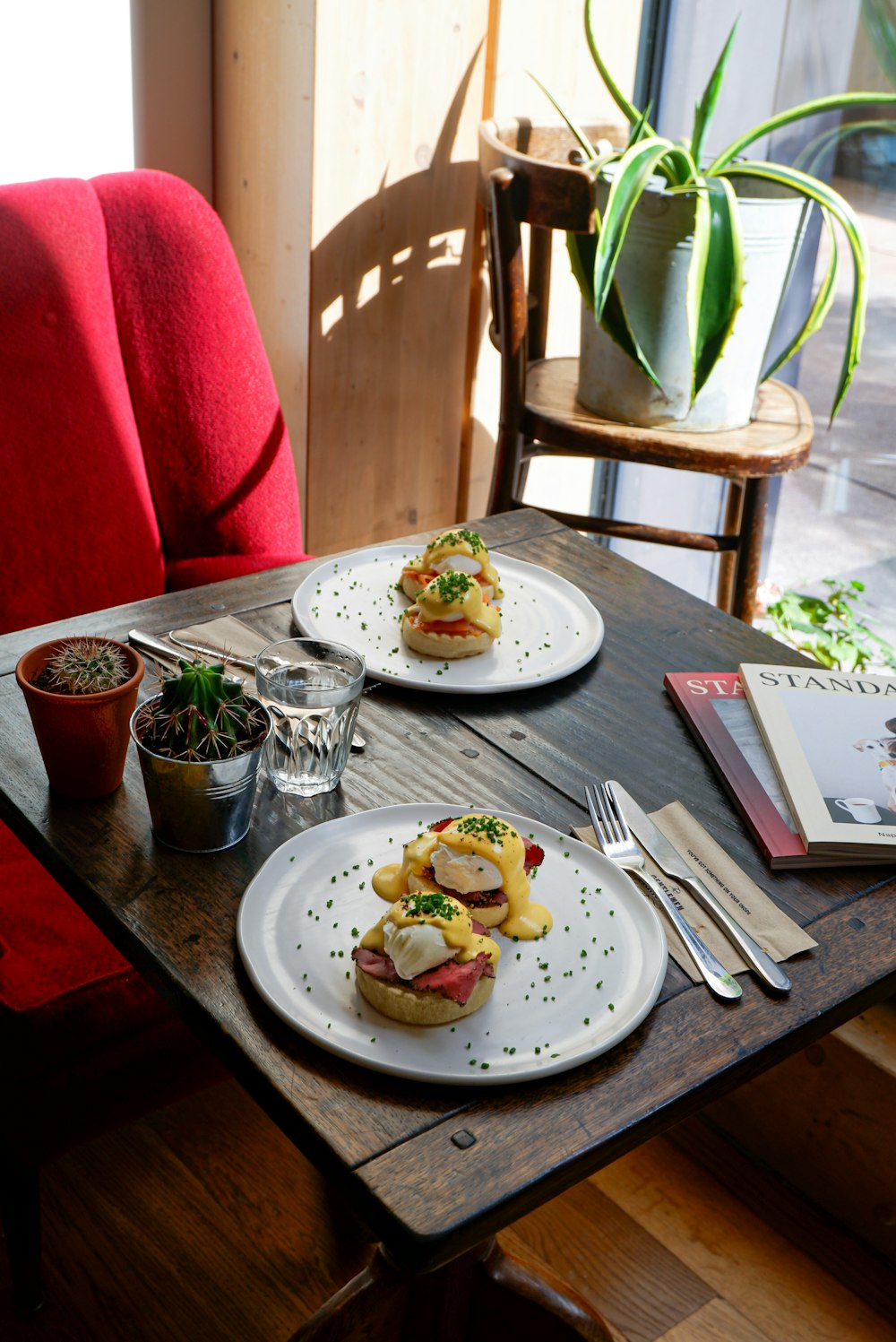 a table with plates of food and glasses on it