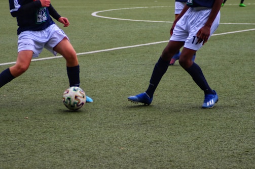 a couple of men playing football