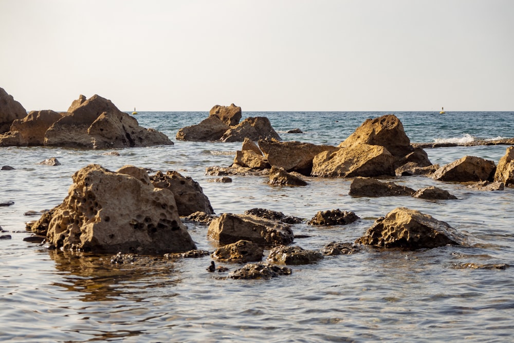 a group of rocks in the water