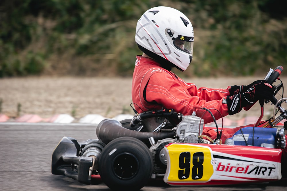 a person driving a go kart