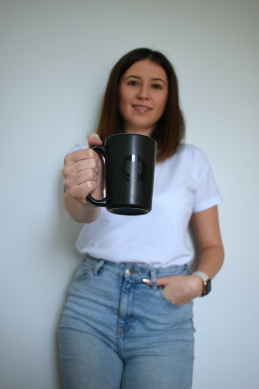 a woman holding a mug