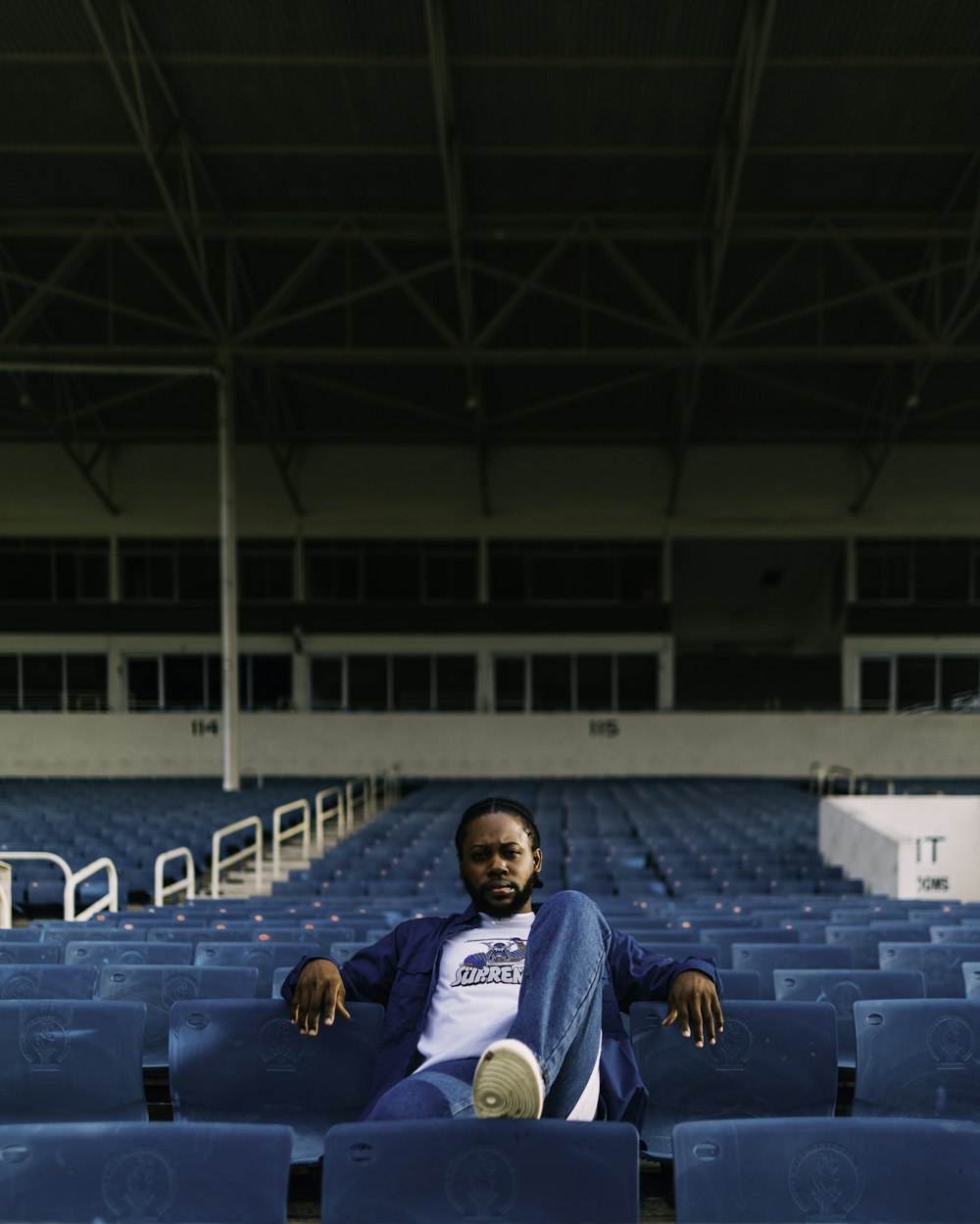 a man sitting in a stadium