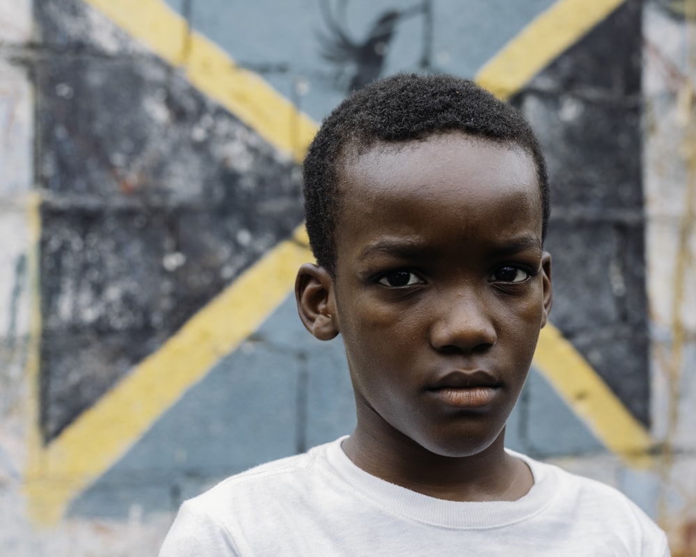 a young boy in a white shirt