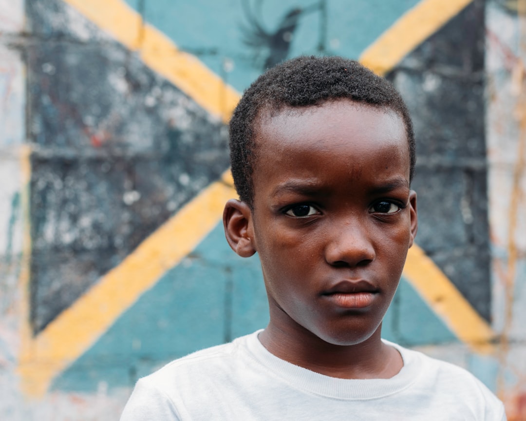 a young boy in a white shirt,