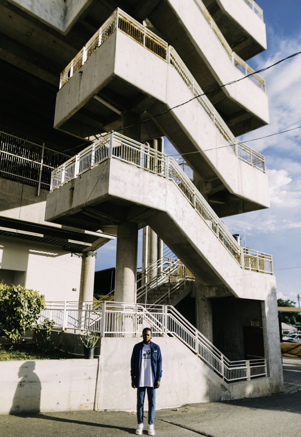 a person standing in front of a large building