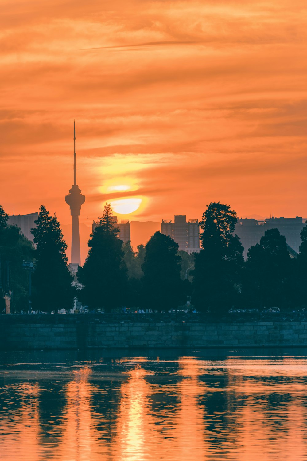 a sunset over a city