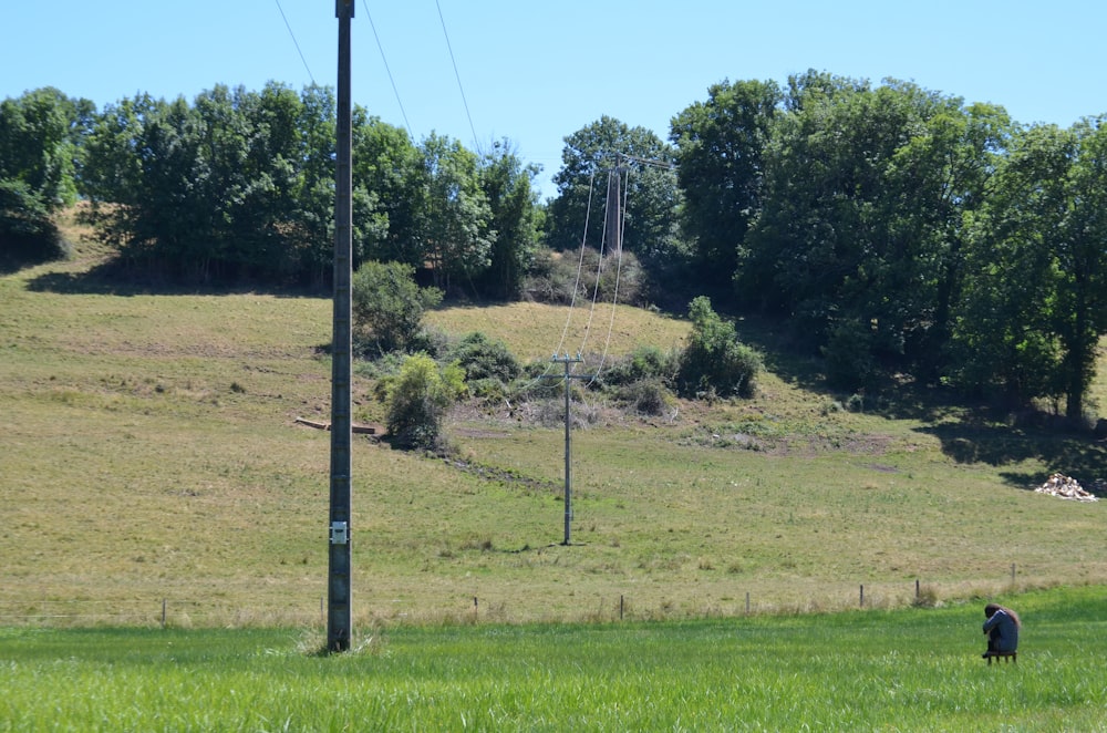 a person sitting in a field