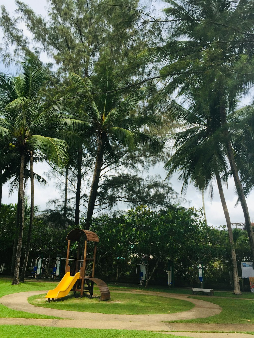 a yellow slide in a park