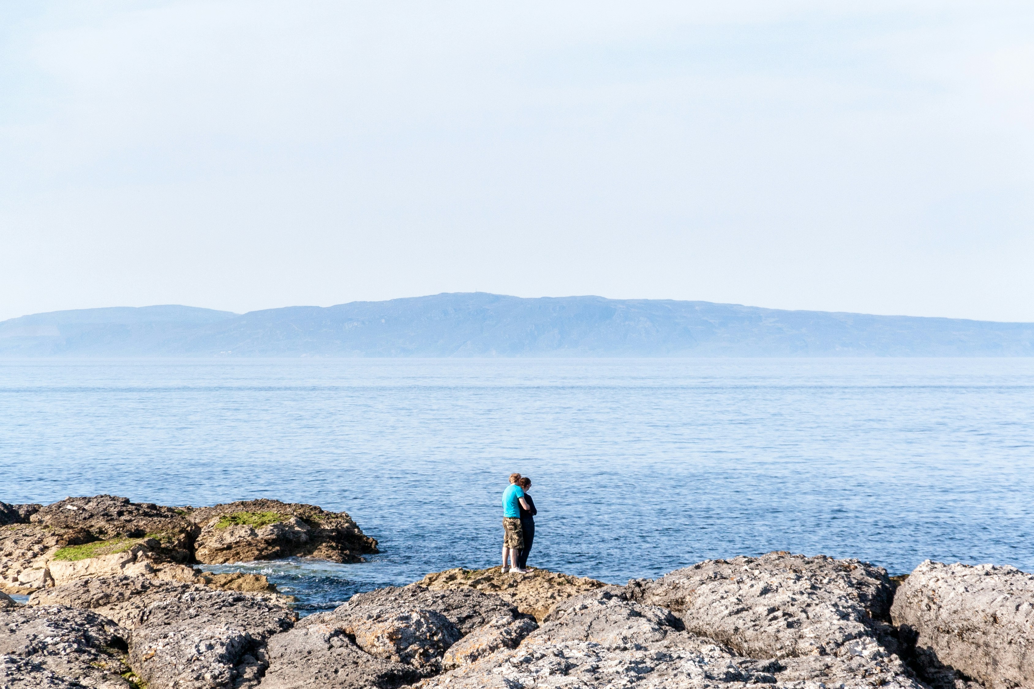 Couple at Torr Head Beach in County Antrim, Northern Ireland.