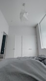 A minimalist bedroom with a calming color palette and contemporary furnishings.
