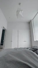 A serene bedroom featuring calming colors and minimalist design for restful nights.