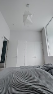 Minimalist bedroom with clean lines and soft neutral colors.