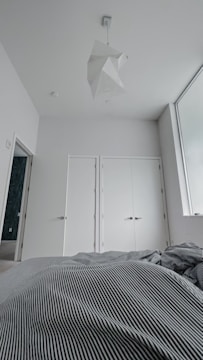 A bright bedroom with fresh paint and minimalist decor.