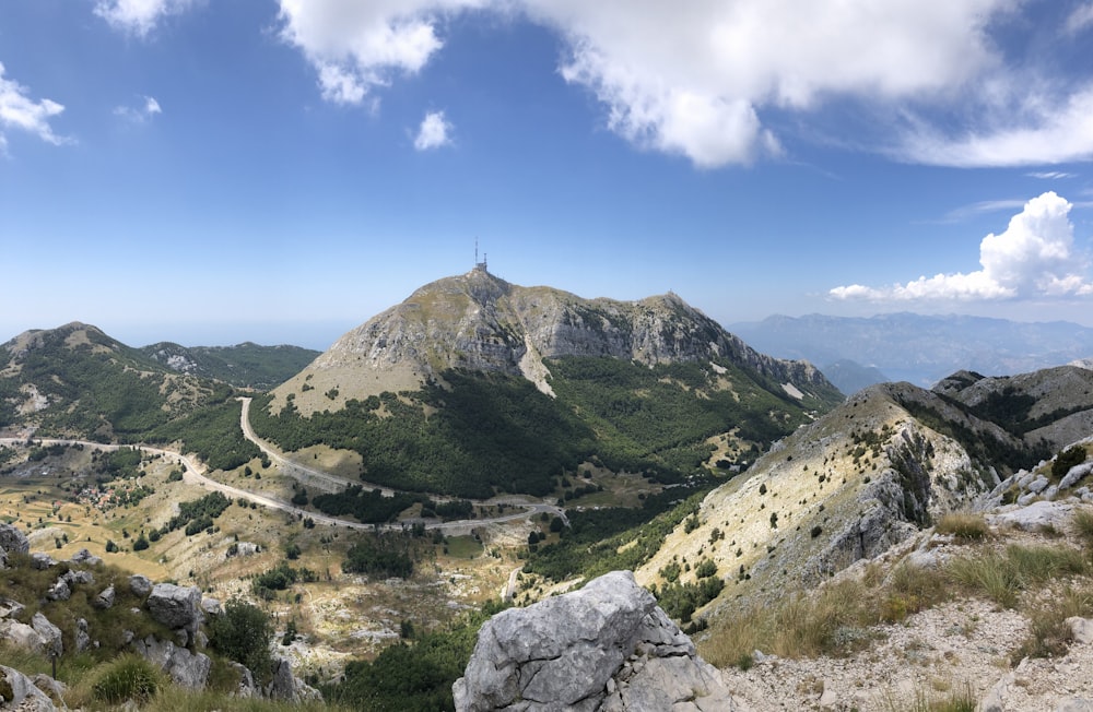 a rocky mountain with a tower