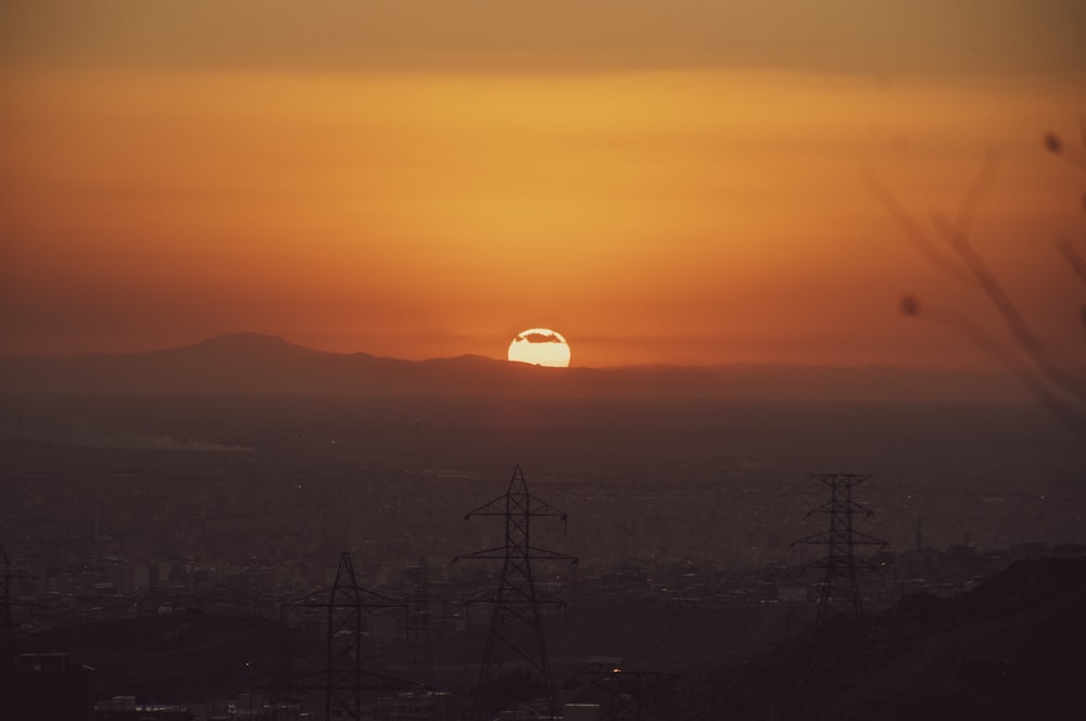 a sunset over a city