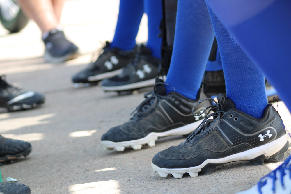 a group of people wearing black shoes