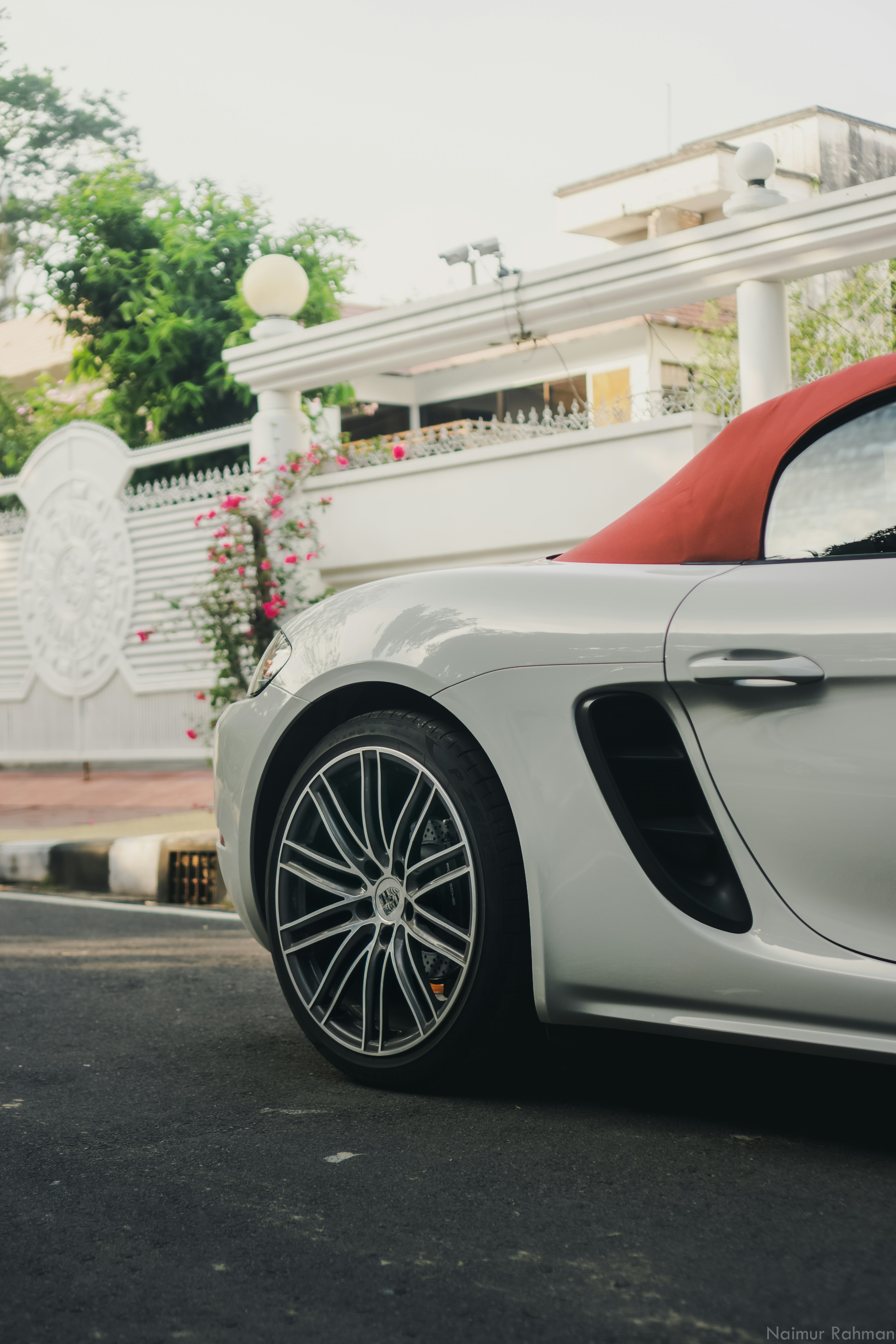 a white car parked on the side of a road