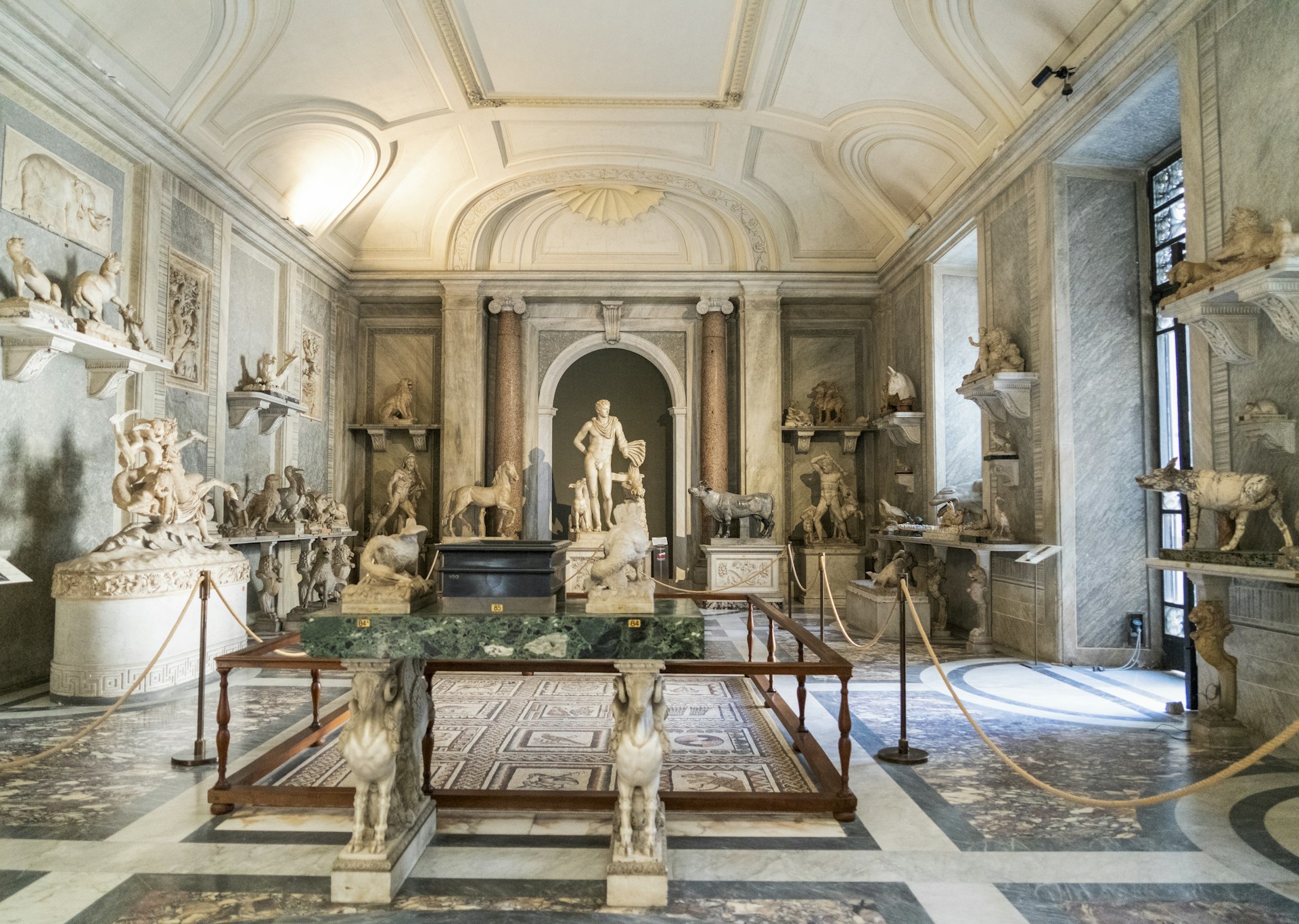 a room with statues and a table