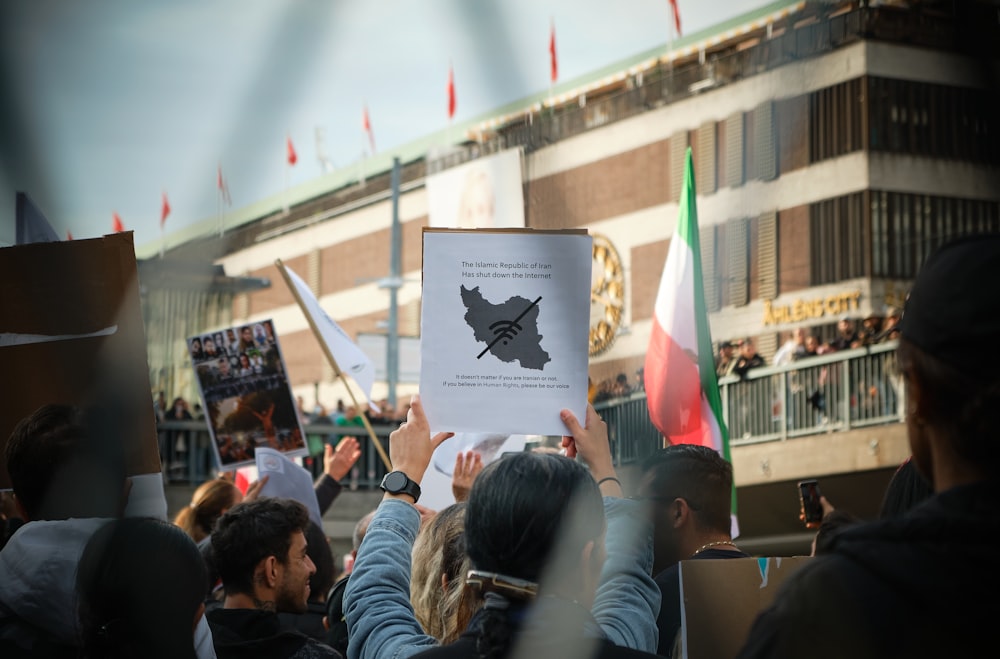 a group of people holding signs