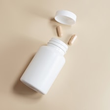 supplement pill in a white container