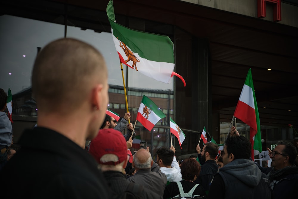 a group of people holding flags