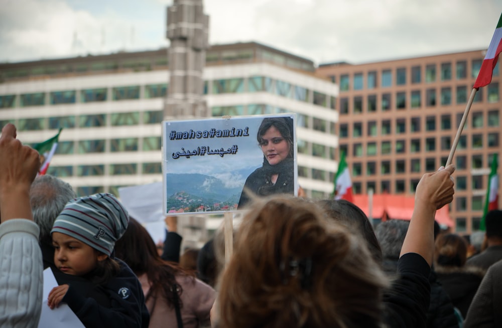 a group of people holding a sign