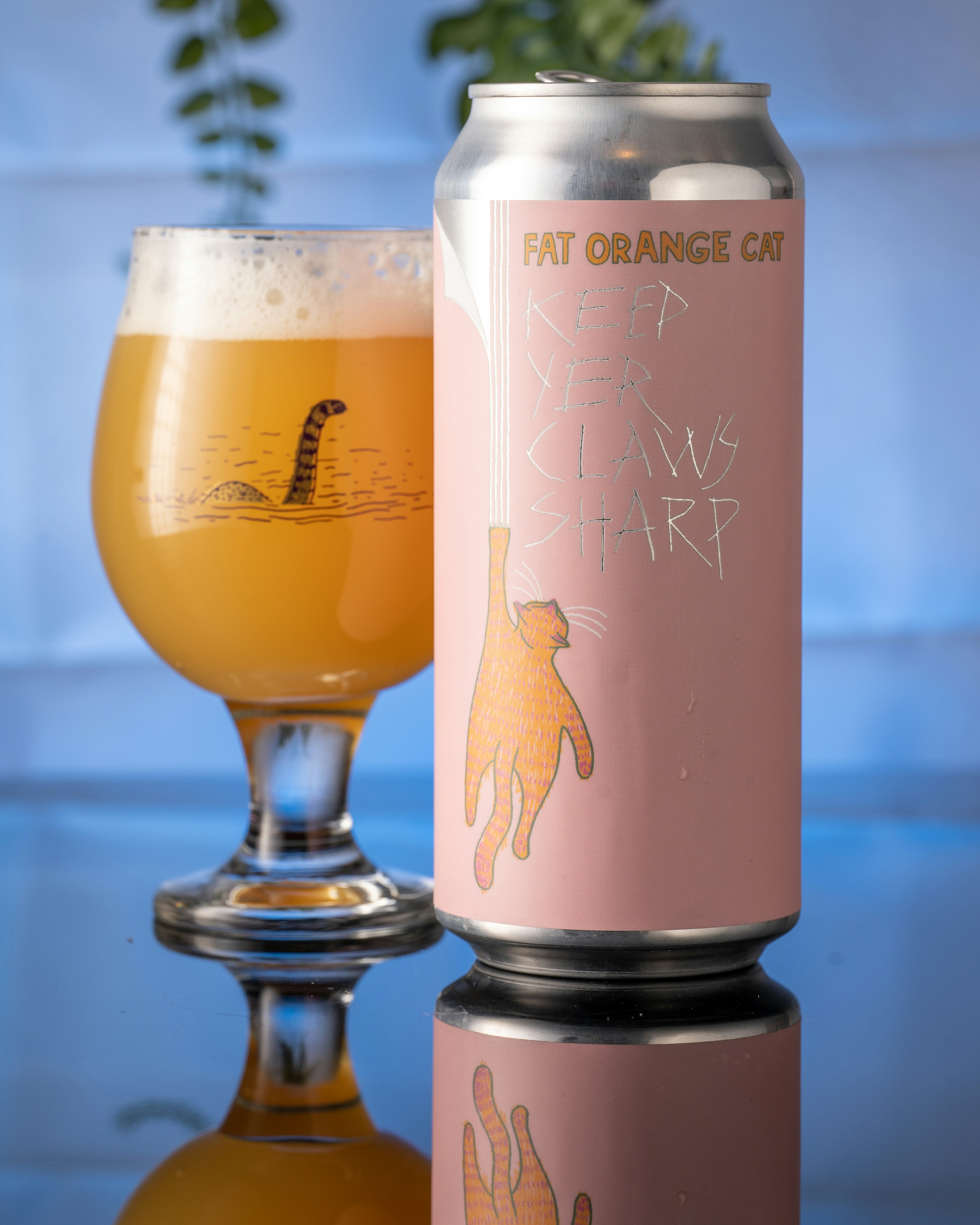 a glass of beer next to a bottle of beer