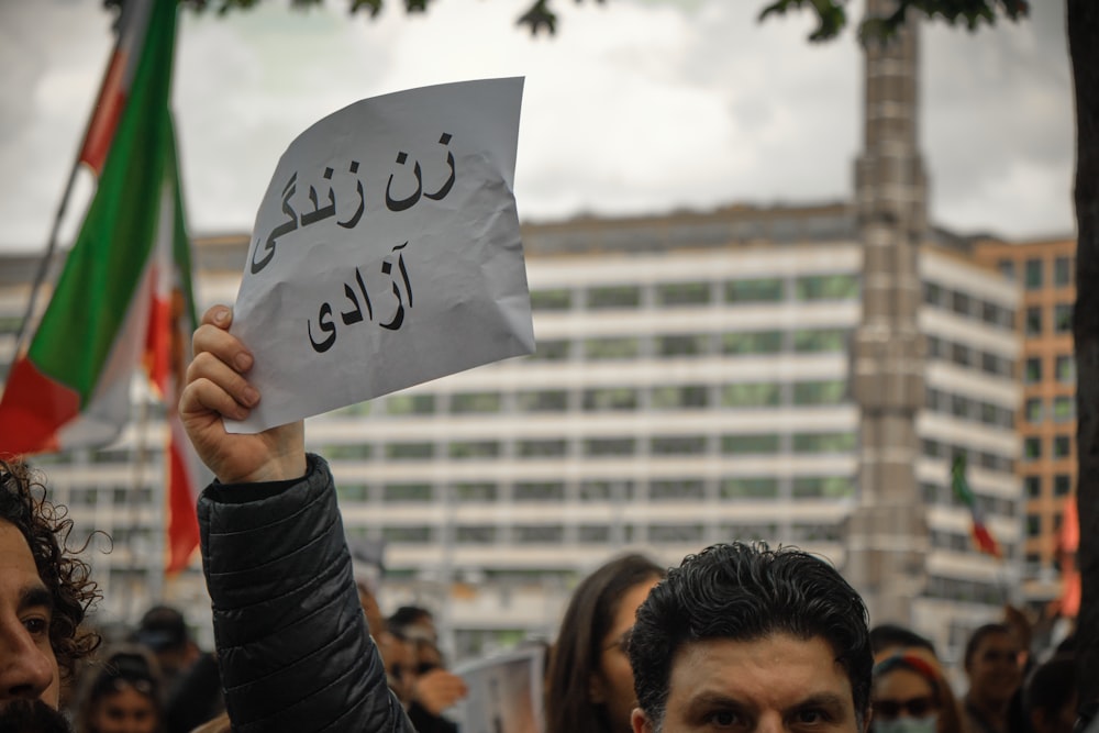 a person holding a sign