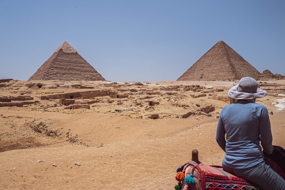 a person looking at pyramids