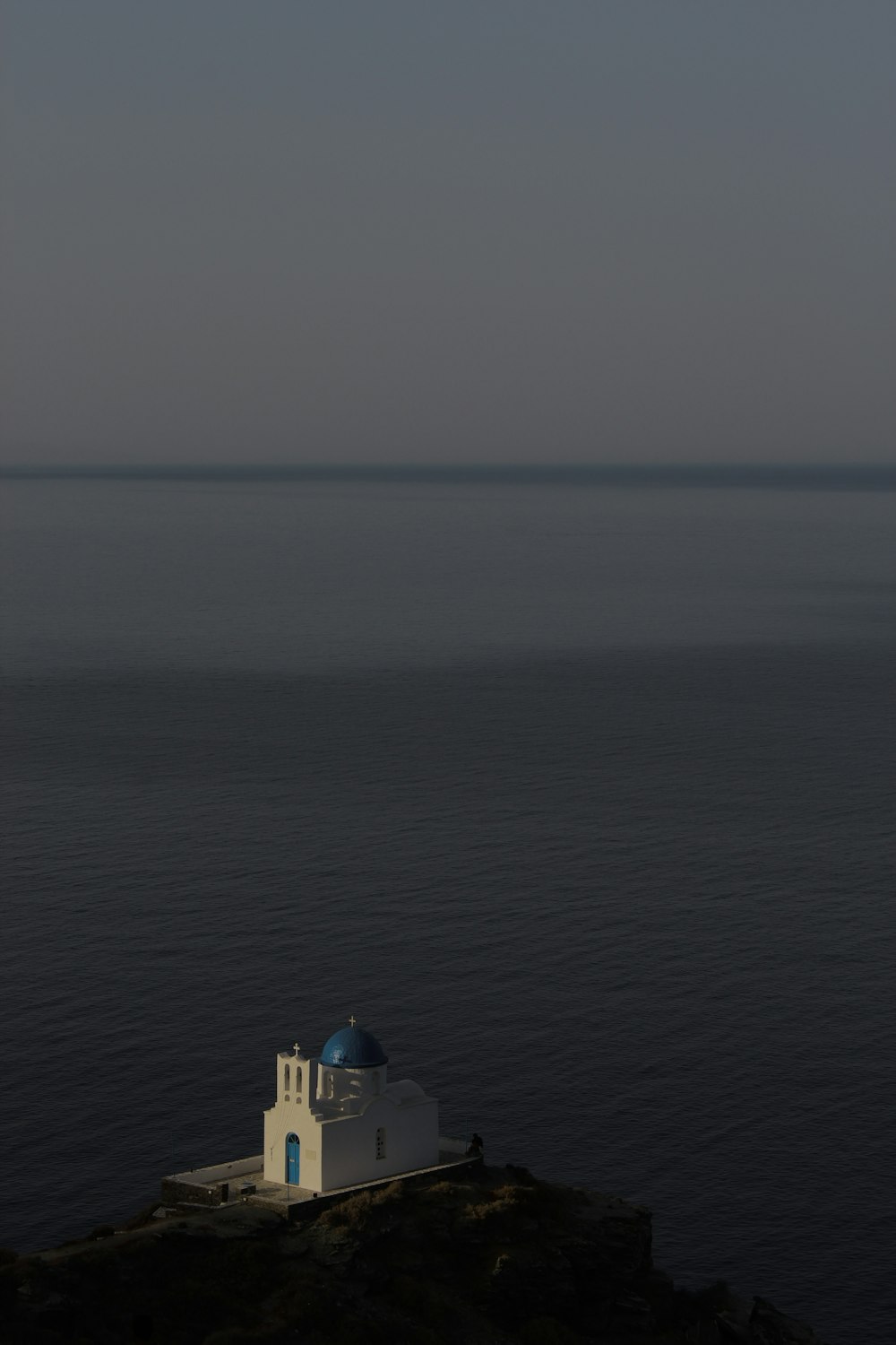 a lighthouse on a rocky cliff