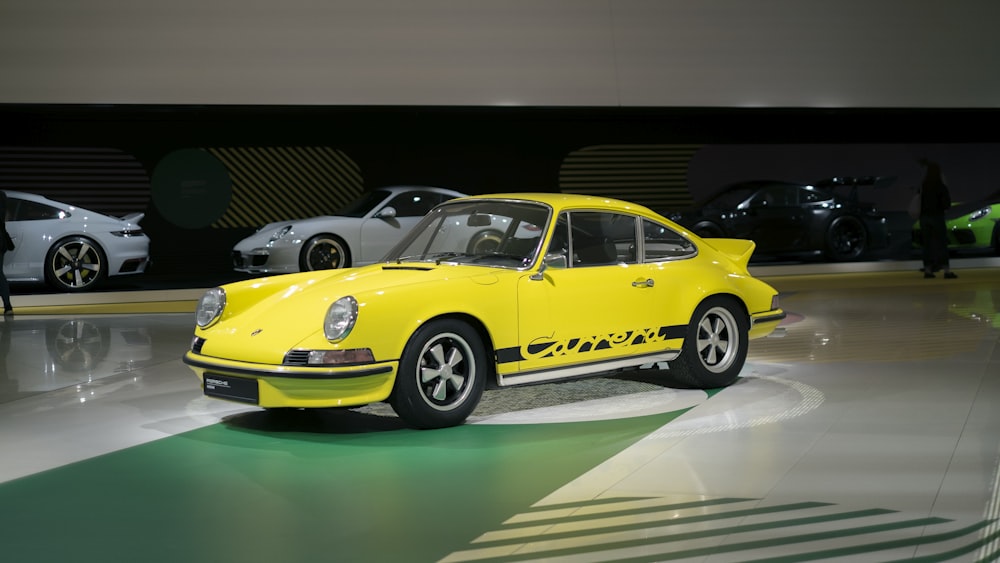 a yellow car parked in a showroom