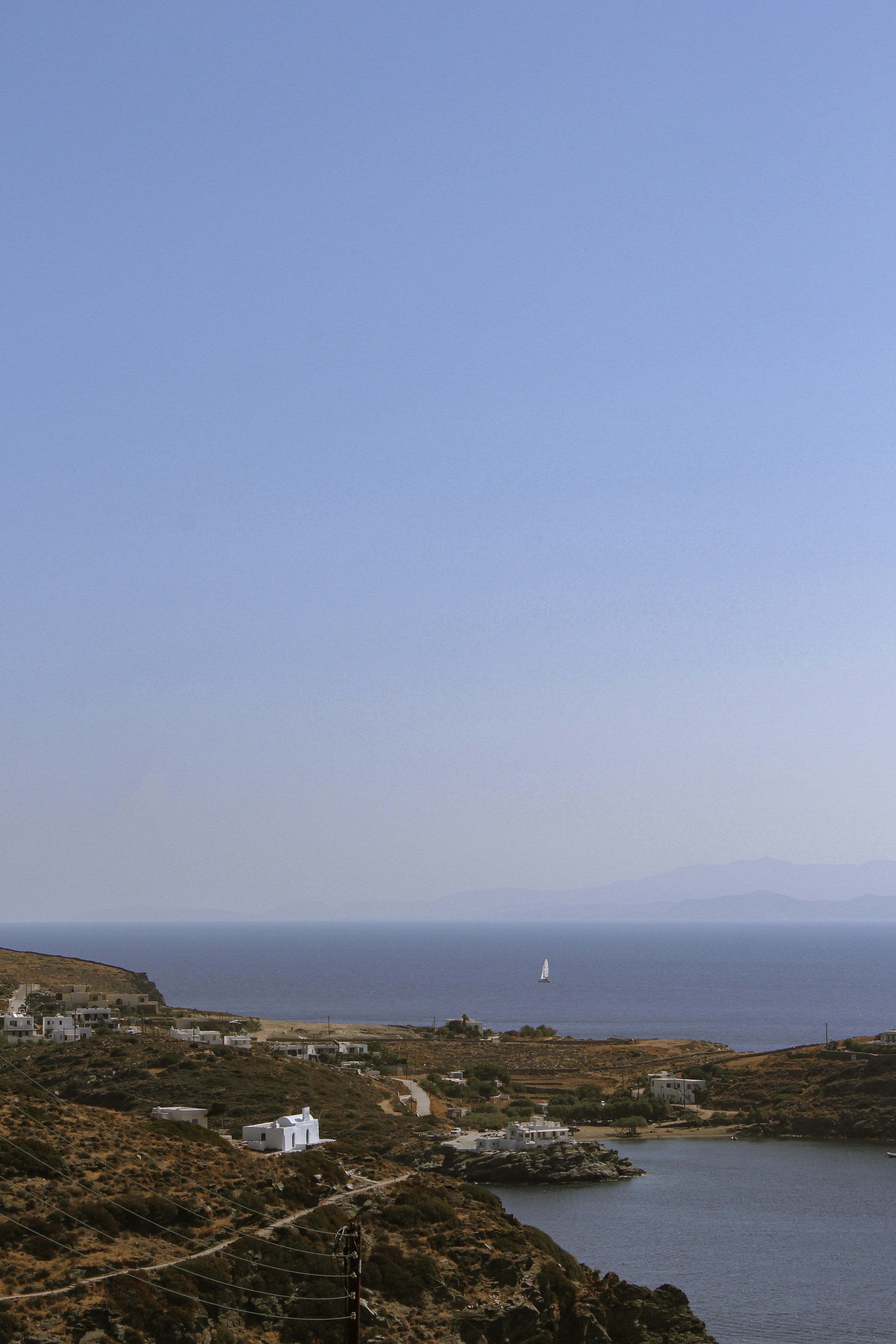 a body of water with buildings and a boat in it