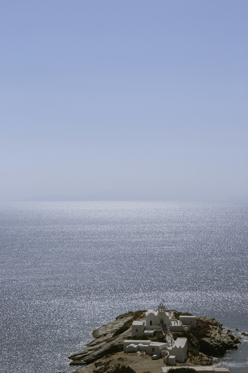 a building on a rocky shore