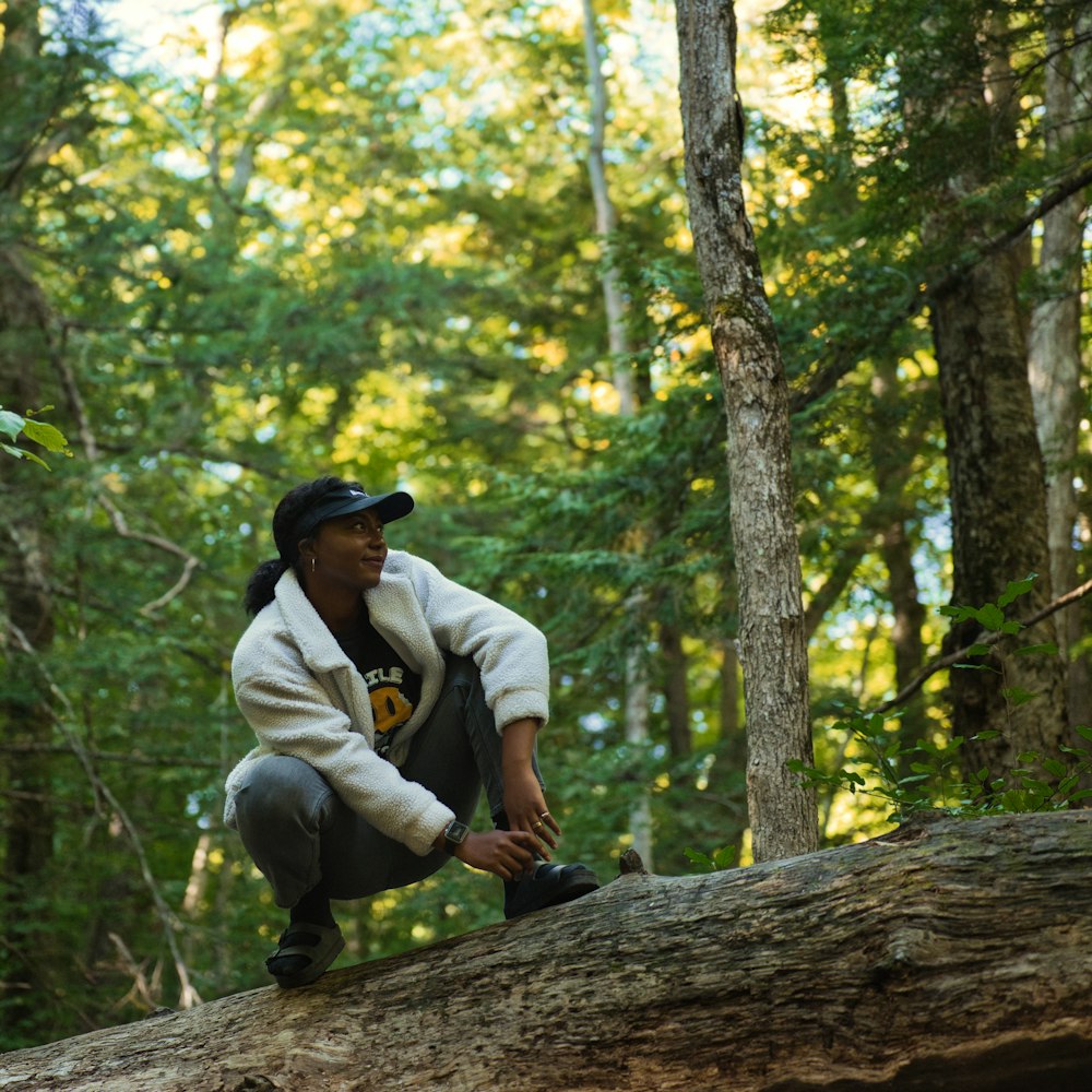 a man sitting on a log