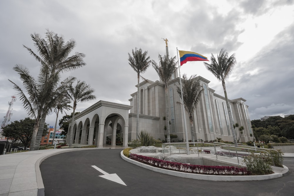 a white building with a flag on top