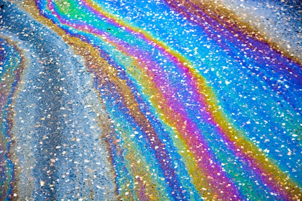 A stunning display of vibrant alcohol ink art on birchwood.