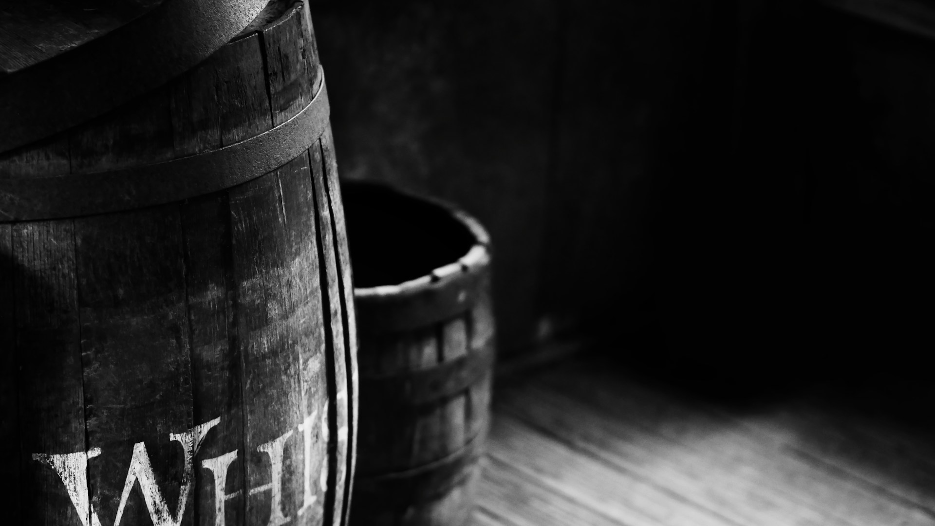 a wood barrel with writing on it