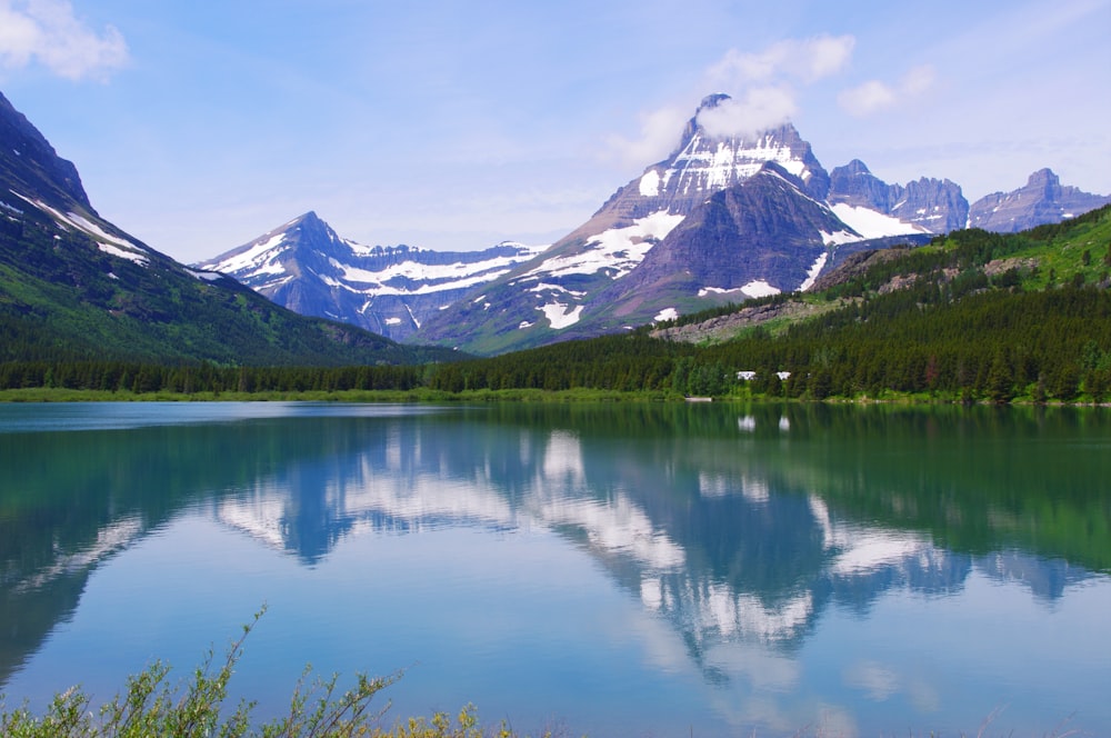 a lake with mountains in the background