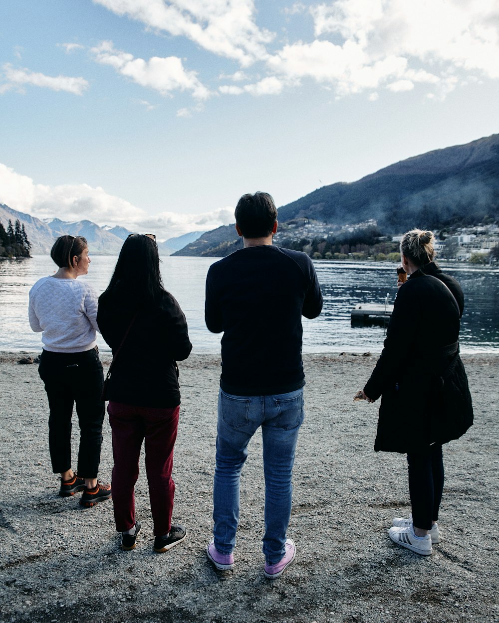 a group of people looking at a body of water