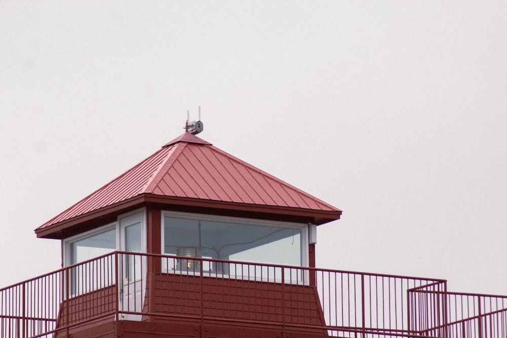 a red building with a white railing