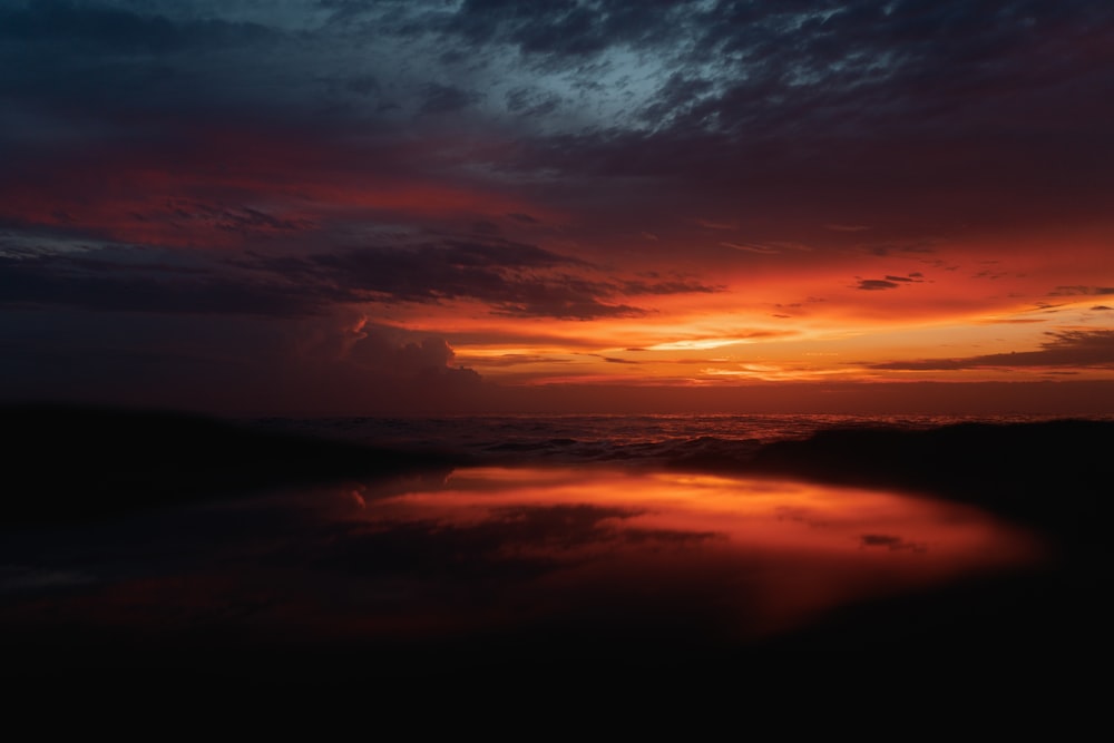 a sunset over a body of water