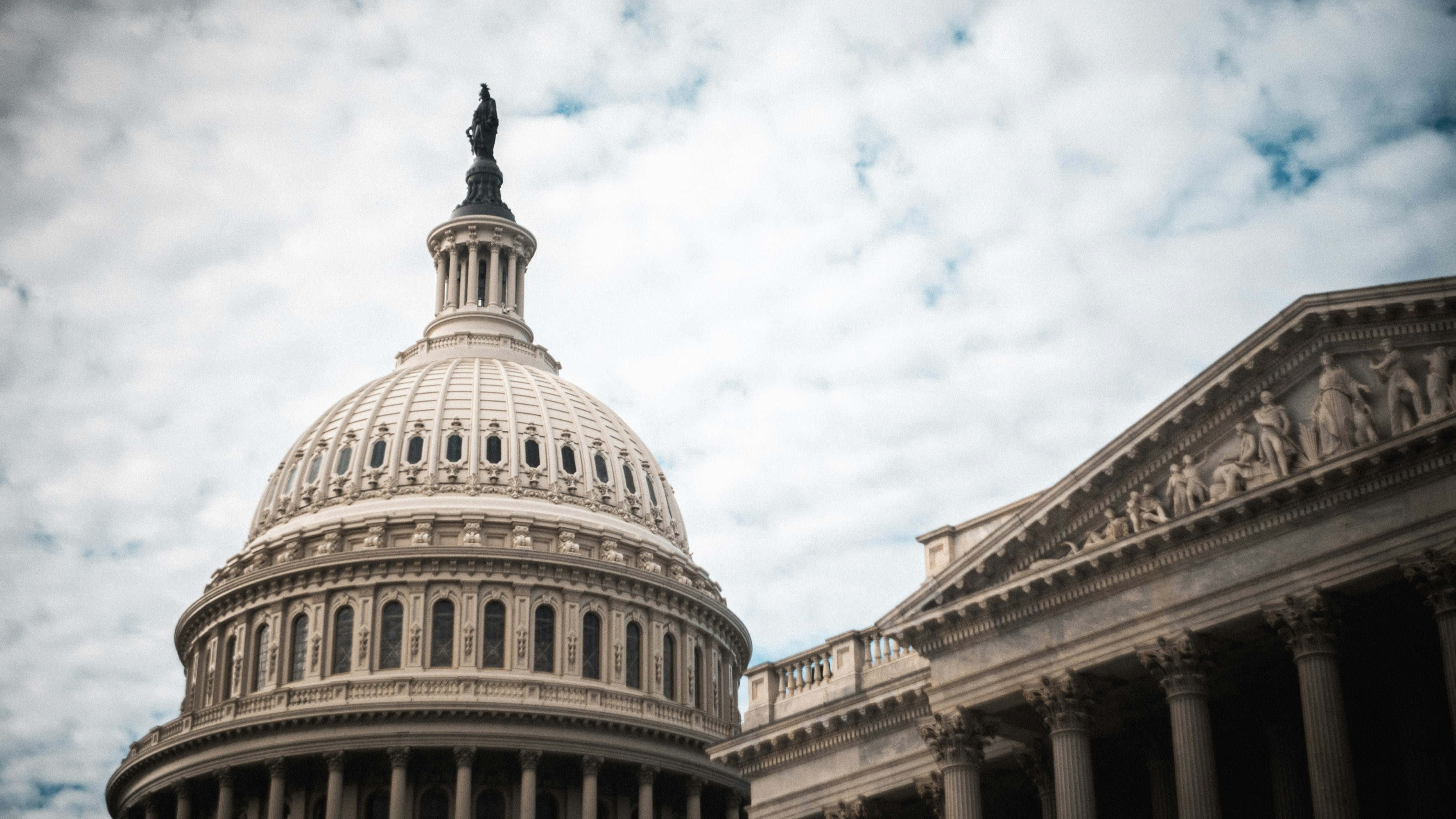 United States Capitol building dome against cloudy sky representing broadcast policy