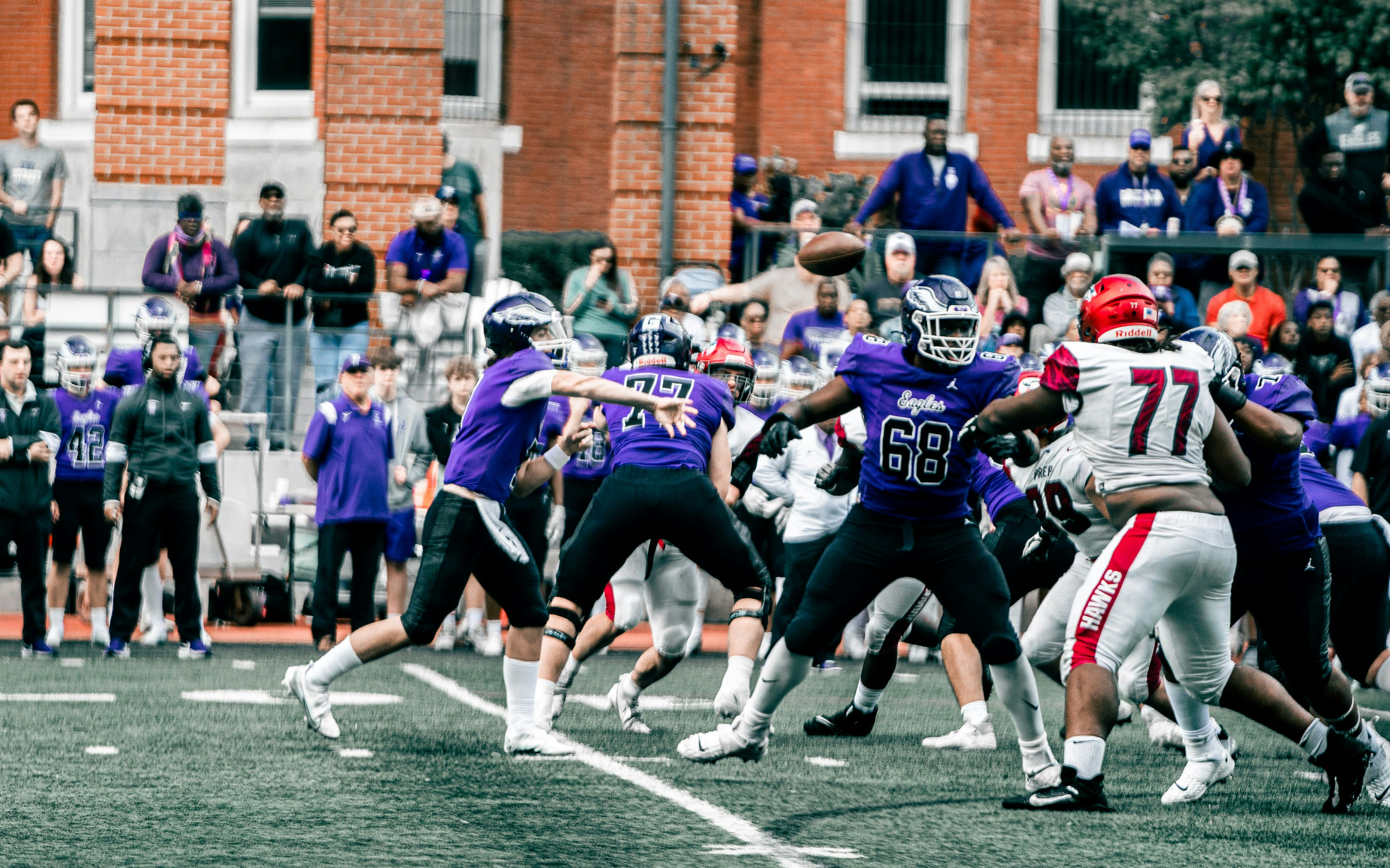 a group of people playing football