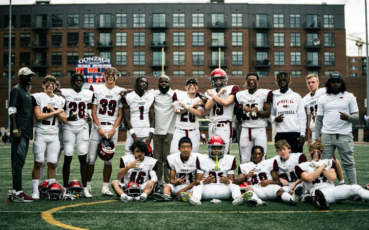 High school football team posing together for a photo, the kind of moment Superintendent's Cup champions will share on Oct. 23
