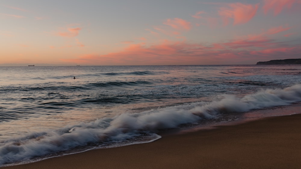 a beach with waves crashing