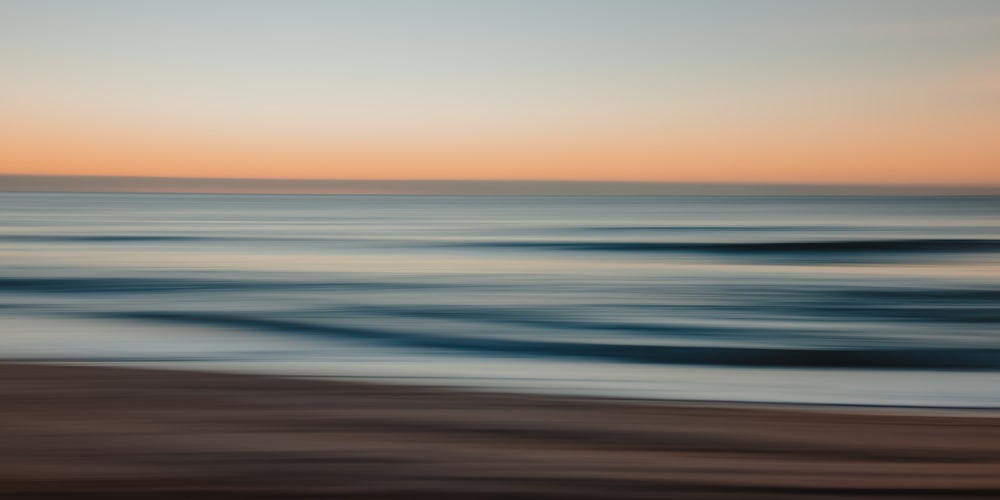 a beach with a body of water